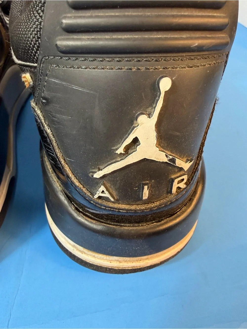 Jordan Black, White & Gold Strap Sneakers
